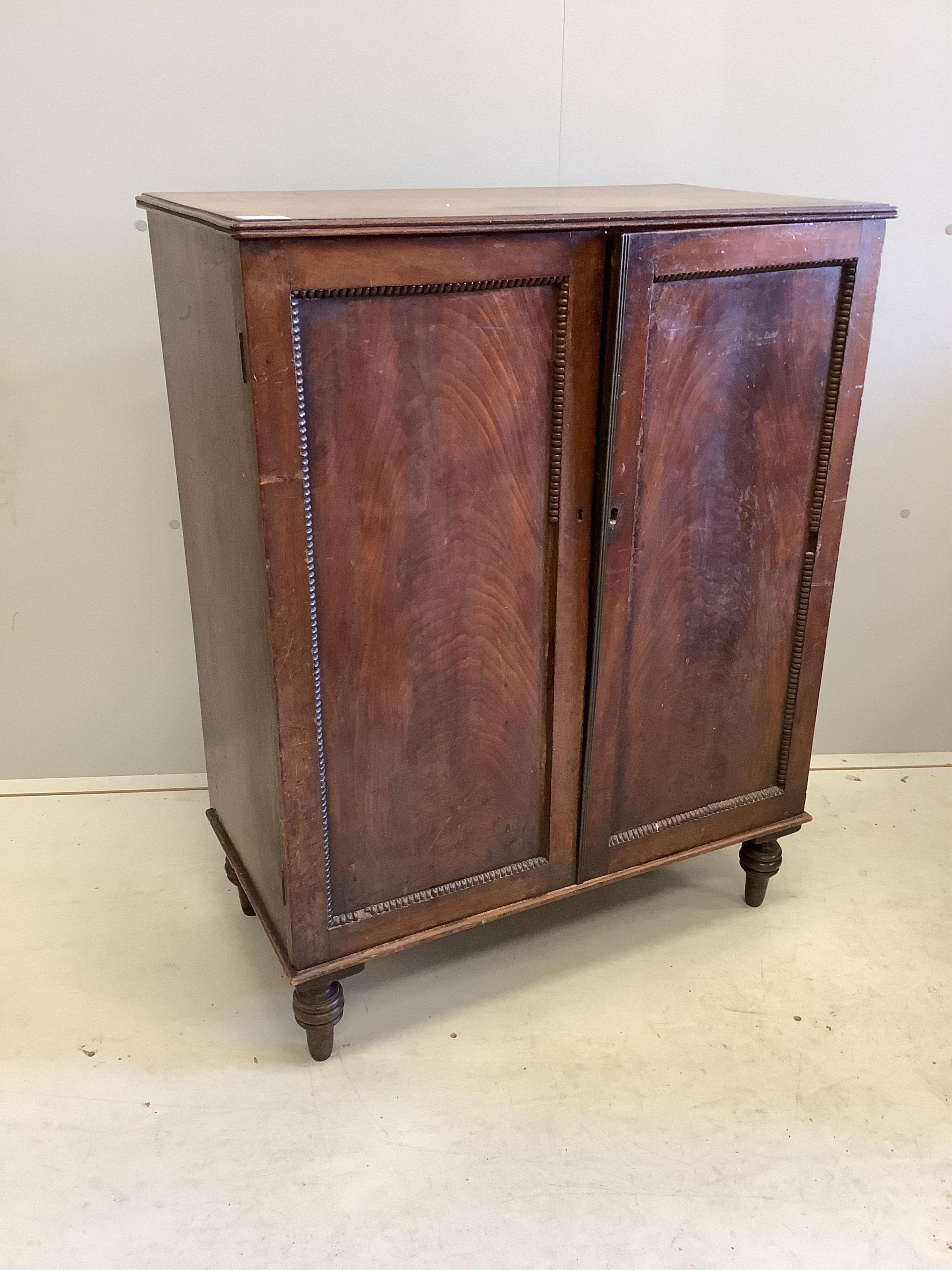 A Regency mahogany two door side cabinet, width 74cm, depth 41cm, height 95cm
